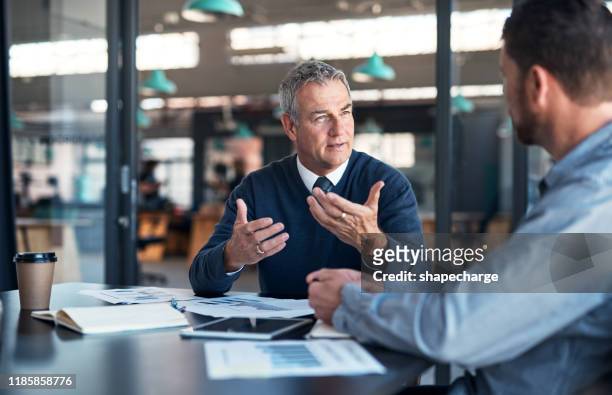 explaining his vision to a colleague - discussion stock pictures, royalty-free photos & images