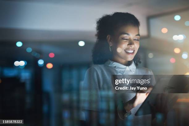 there's no better way to stay organized - woman smiling using digital tablet stock pictures, royalty-free photos & images