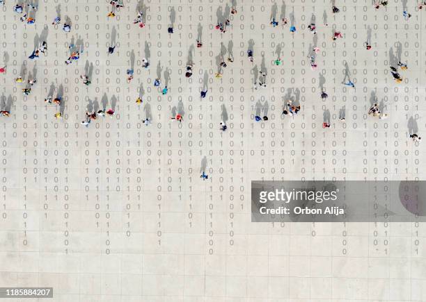 crowd walking over binary code - aerial walking stock pictures, royalty-free photos & images