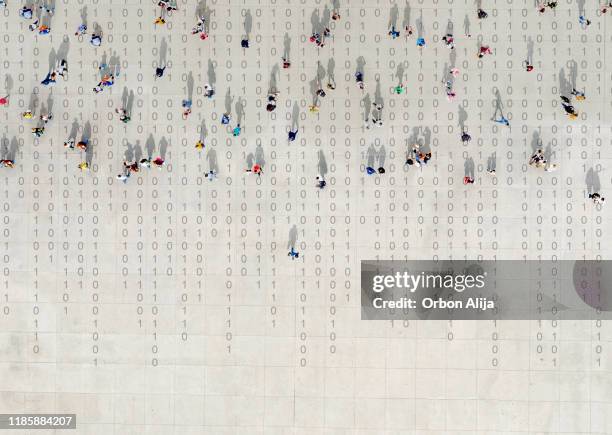 crowd walking over binary code - mission imagens e fotografias de stock