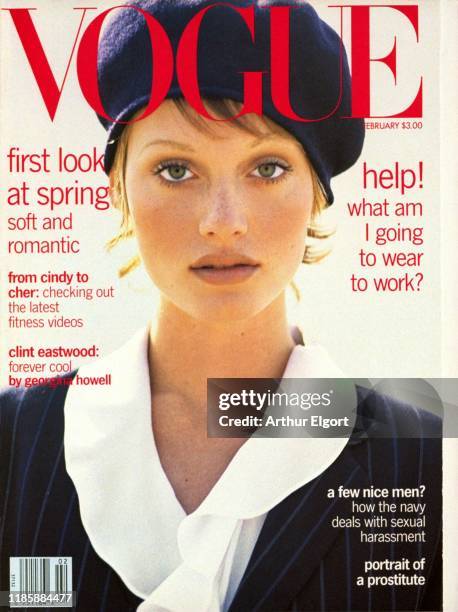 Vogue, February 1993 - Magazine cover featuring model Amber Valletta in white ruffled blouse, pin-striped jacket, and beret by Ralph Lauren.