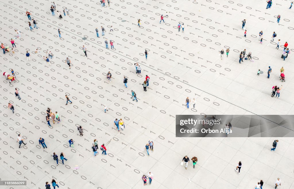 Crowd walking over binary code