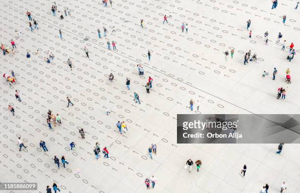 crowd walking over binary code - big data stock pictures, royalty-free photos & images