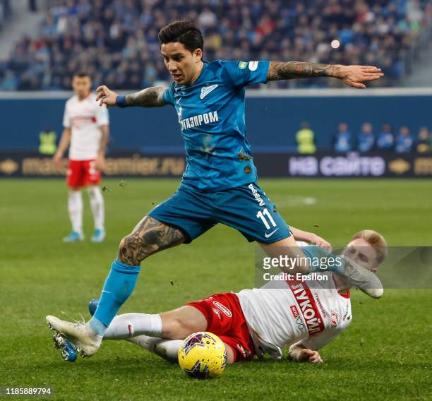 Sebastian Driussi of FC Zenit Saint Petersburg and Nail Umyarov of FC Spartak Moscow vie for the ball during the Russian Premier League match between...