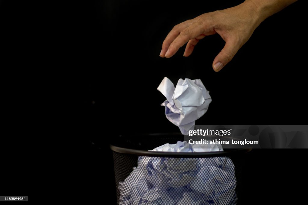 Man Throwing Away Papers into Trash Bin, Inspiration, Creativity and Idea Concept For Business