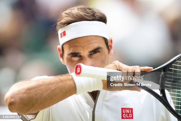 Roger Federer of Switzerland in action during the Men's Quarter Final against Kei Nishikori of Japan at The Wimbledon Lawn Tennis Championship at the...