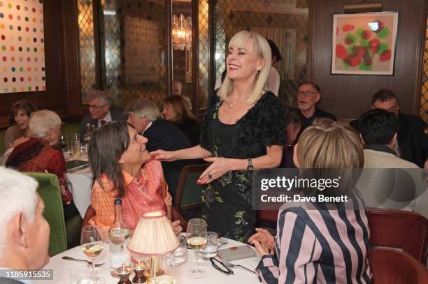 Tracie Bennett serves guests during One Night Only at The Ivy in aid of Acting For Others on December 1, 2019 in London, United Kingdom.