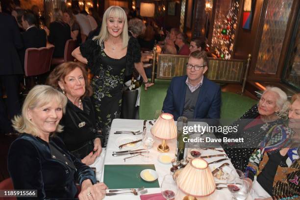 Tracie Bennett serves guests during One Night Only at The Ivy in aid of Acting For Others on December 1, 2019 in London, United Kingdom.