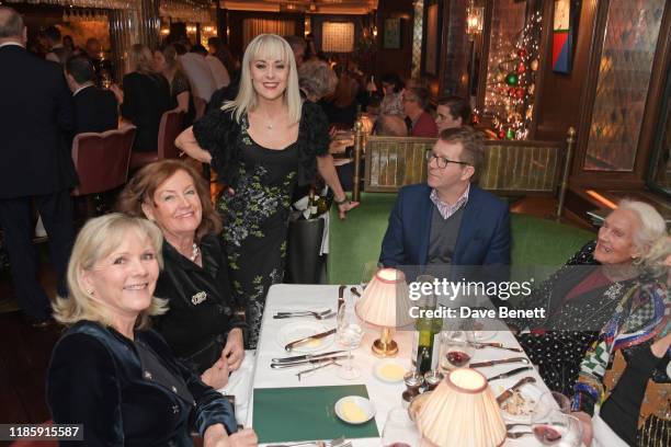 Tracie Bennett serves guests during One Night Only at The Ivy in aid of Acting For Others on December 1, 2019 in London, United Kingdom.