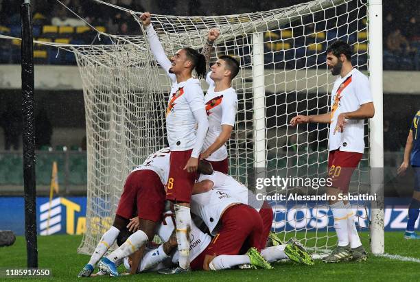 Henrikh Mkhitaryan of As Roma celebrates after scoring the 1-3 goal with team mates during the Serie A match between Hellas Verona and AS Roma at...