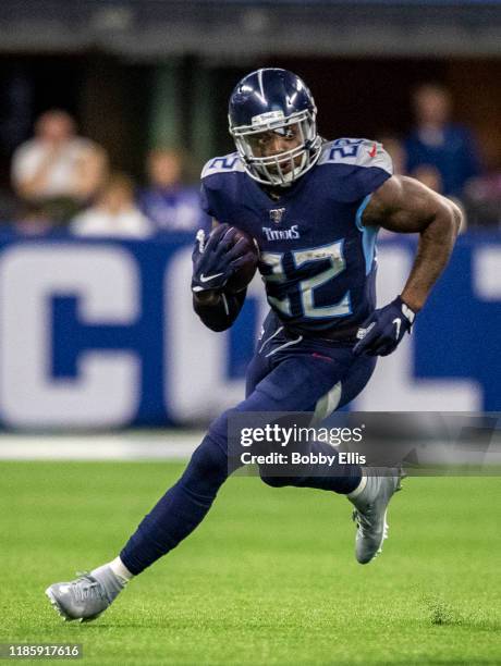 Derrick Henry of the Tennessee Titans runs for a first down during the fourth quarter of the game against the Indianapolis Colts at Lucas Oil Stadium...