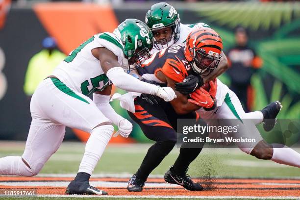 Albert McClellan and James Burgess of the New York Jets tackle Giovani Bernard of the Cincinnati Bengals during the second half of NFL football game...