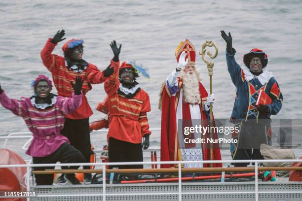 Sinterklaas and his helpers Zwarte Piet or Black Pete arrives at Uerdingen harbor on 1st December 2019 in Uerdingen, Germany. The Dutch tradition of...