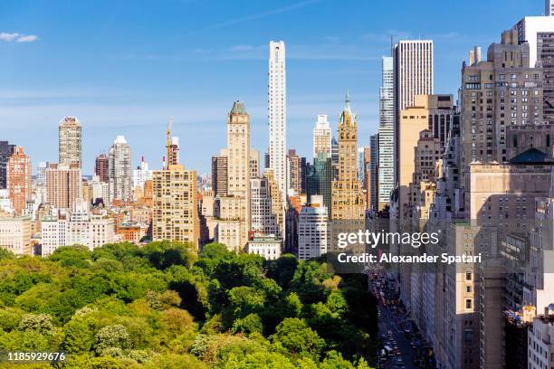 central park and skyscrapers of upper east side, new york, usa - aerial view of mid town manhattan new york stock pictures, royalty-free photos & images