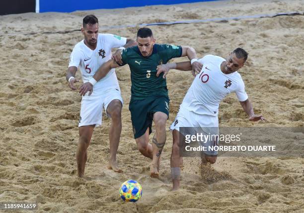 Portugal's Ruben Brilhante and Belchior vie for the ball with Italy's Marcello Percia during their final FIFA Beach Soccer World Cup Paraguay 2019...