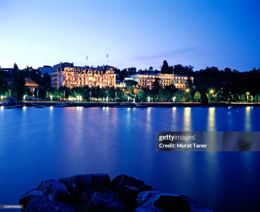 Hotel buildings on the waterfront at nigh in Lausanne