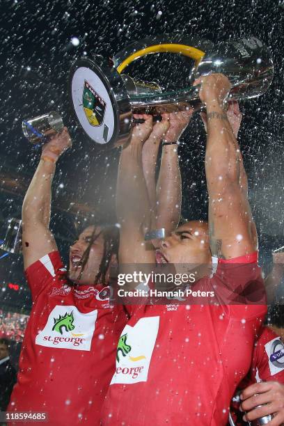 Saia Faingaa and Will Genia of the Reds celebrate winning the 2011 Super Rugby Grand Final match between the Reds and the Crusaders at Suncorp...