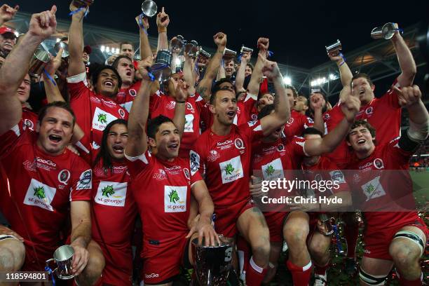 Reds celebrate winning the 2011 Super Rugby Grand Final match between the Reds and the Crusaders at Suncorp Stadium on July 9, 2011 in Brisbane,...