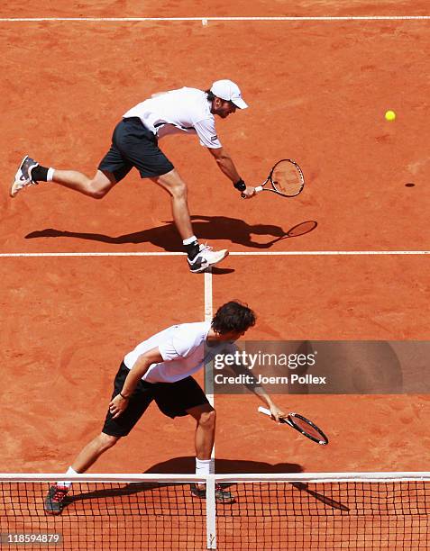 Christopher Kas and Philipp Petzschner of Germany in action during their doubles match against Michael Llodra and Jo-Wilfried Tsonga of France during...