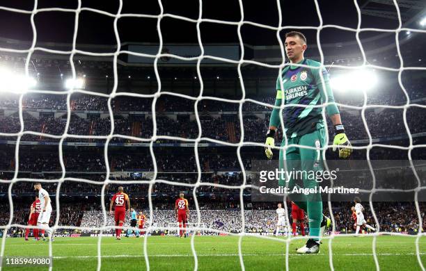 Fernando Muslera of Galatasaray reacts after the first goal during the UEFA Champions League group A match between Real Madrid and Galatasaray at...