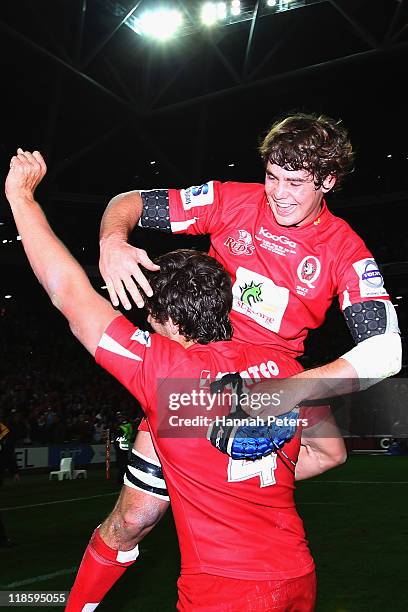 Liam Gill celebrates with Rob Simmons of the Reds after winning the 2011 Super Rugby Grand Final match between the Reds and the Crusaders at Suncorp...