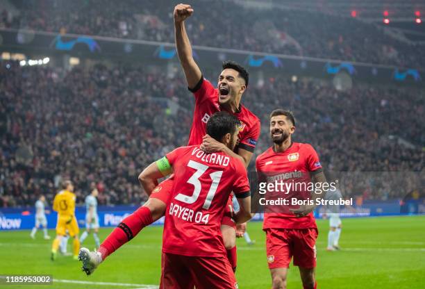 Kevin Volland of Bayer 04 Leverkusen celebrates with team mates after scoring his team's second goal during the UEFA Champions League group D match...