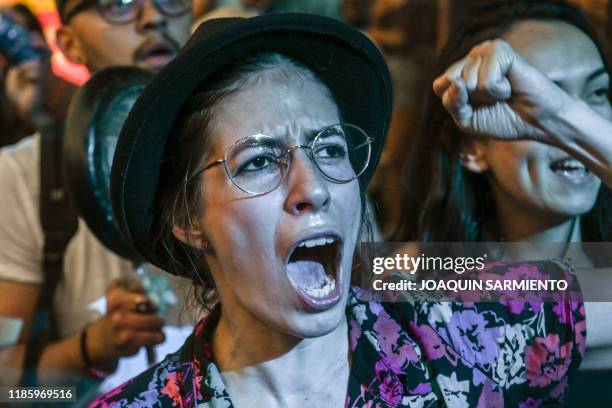 People attend to a concert in support of the strike against the government of Colombian President Ivan Duque, in Medellin, Colombia on December 1...