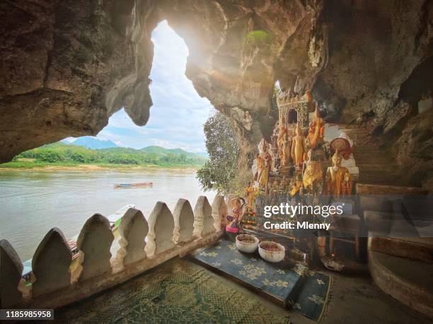 pak ou cave buddhas laos mekong river - pak ou caves stock pictures, royalty-free photos & images