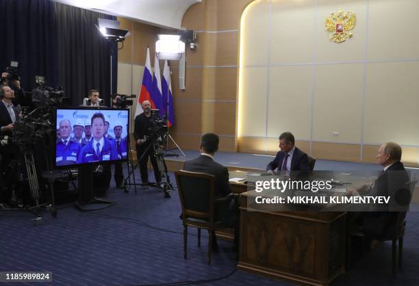 Russian President Vladimir Putin, accompanied by Energy Minister Alexander Novak and Deputy Prime Minister of Russia Dmitry Kozak, takes part in a...