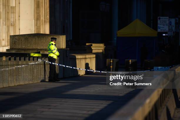 Police officer stands next to where Usman Khan was shot, on London Bridge, on December 2, 2019 in London, England. Usman Khan, a 28 year old former...