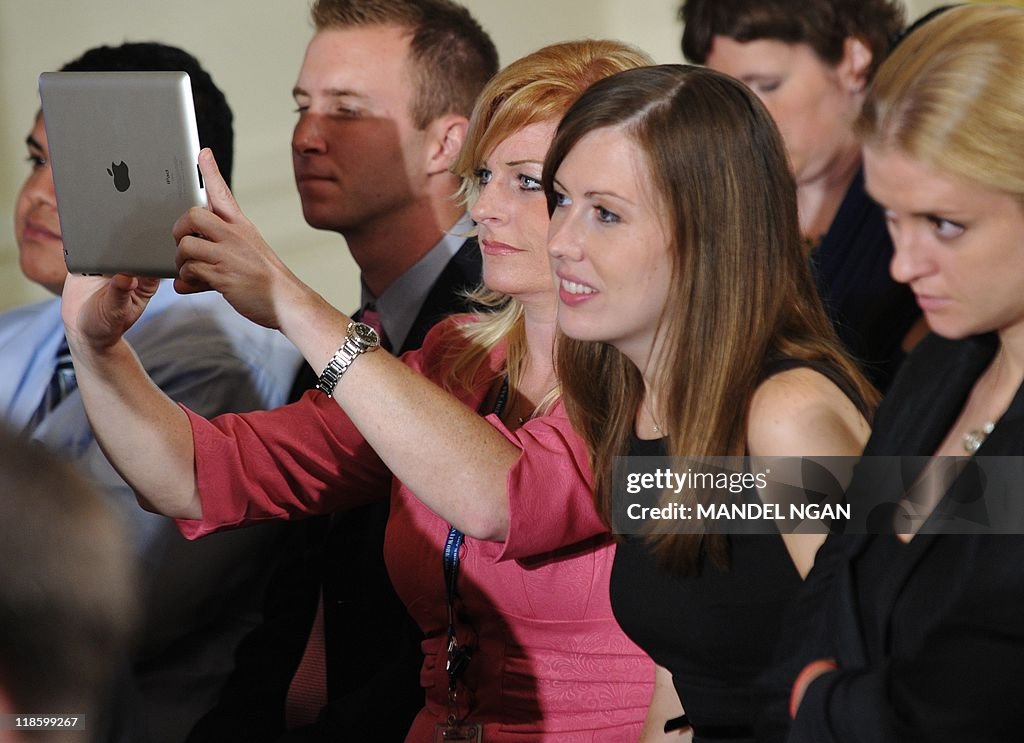 An attendee uses an iPad during a "Twitt