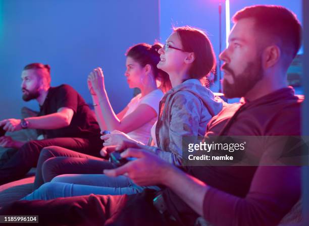 couples playing competitive video games - gaming championship stock pictures, royalty-free photos & images