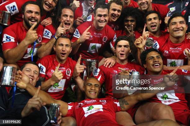 Reds players sing their team song after winning the 2011 Super Rugby Grand Final match between the Reds and the Crusaders at Suncorp Stadium on July...