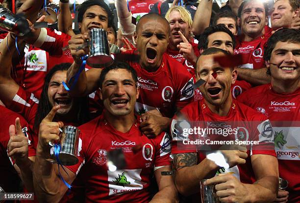 Reds players sing their team song after winning the 2011 Super Rugby Grand Final match between the Reds and the Crusaders at Suncorp Stadium on July...