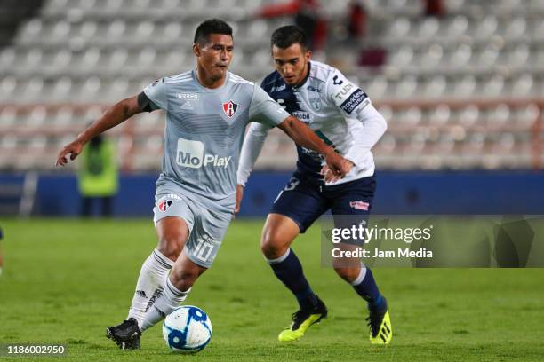 Osvaldo Martinez of Atlas fights for the ball with Ulises Cardona of Pachuca during the 7th round match between Pachuca and Atlas as part of the Copa...