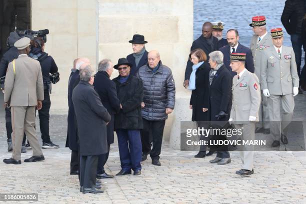 Mayor of Pau, Francois Bayrou shakes hands with Mali's President Ibrahim Boubacar Keita flanked by French Foreign Affairs Minister Jean-Yves Le Drian...