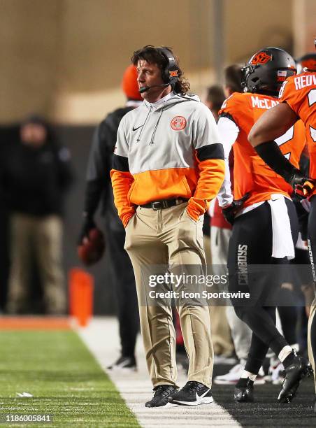 Oklahoma State Cowboys head coach Mike Gundy paces the sideline during a college football game between the Oklahoma State Cowboys and the Oklahoma...