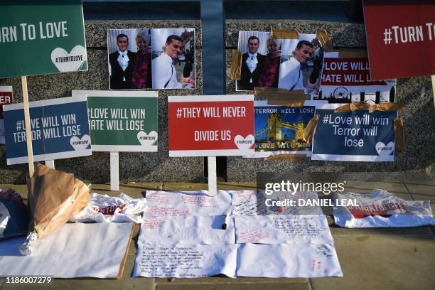 Banners and pictures are placed on London Bridge in memory of the victims of last weeks attack in central London on December 12, 2019. - Tributes...