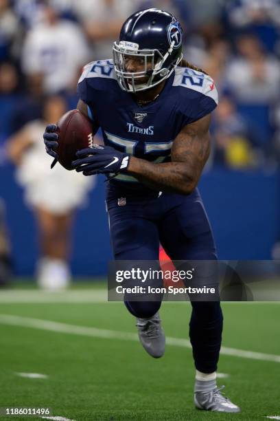 Tennessee Titans running back Derrick Henry catches a handoff during the NFL game between the Tennessee Titans and the Indianapolis Colts on December...