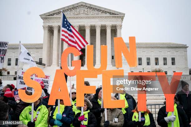 Gun safety advocates rally in front of the U.S. Supreme Court before during oral arguments in the Second Amendment case NY State Rifle & Pistol v....