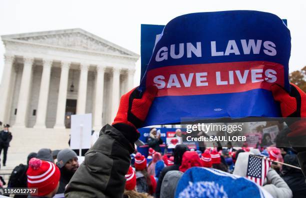Supporters of gun control and firearm safety measures hold a protest rally outside the US Supreme Court as the Court hears oral arguments in State...