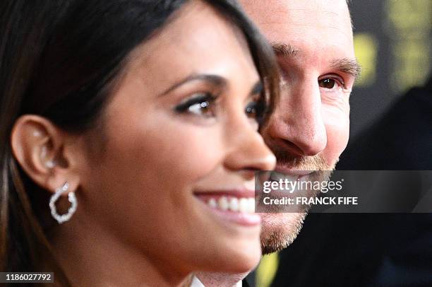 Barcelona's Argentinian forward Lionel Messi and his wife Antonella Roccuzzo arrive to attend the Ballon d'Or France Football 2019 ceremony at the...
