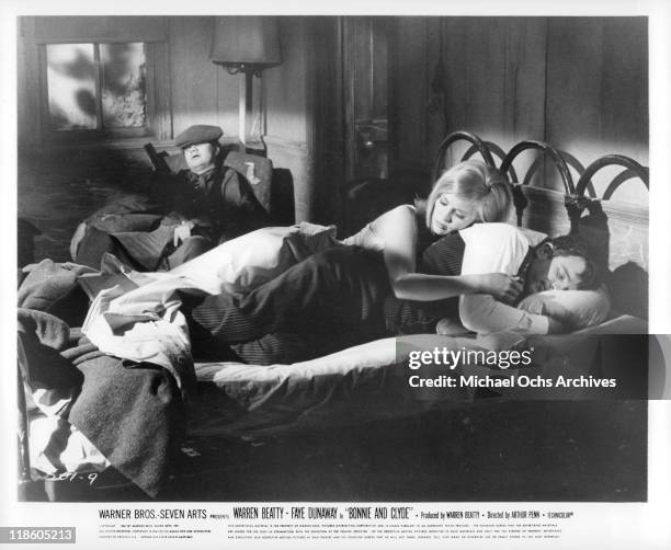 Michael J Pollard, Faye Dunaway, and Warren Beatty sleep in a scene from the film 'Bonnie and Clyde', 1967.
