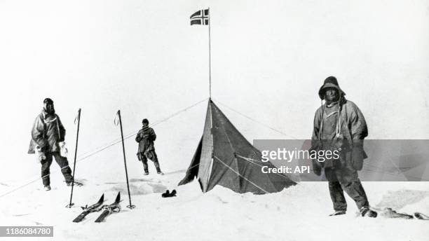 Terra Nova expedition at the South Pole with Roald Amundsen's tent in the background, Polheim camp, 18th January 1912. British Antarctic Expedition...