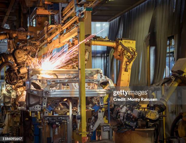 robots welding car bodies in car factory - chassis stock pictures, royalty-free photos & images