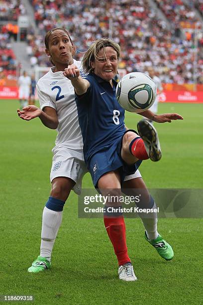 Alex Scott of England challenges Sonia Bompastor of France during the FIFA Women's World Cup 2011 Quarter Final match between England and France at...