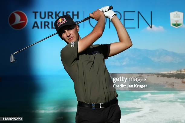 Matthias Schwab of Austria practices his swing on the 14th tee during Day One of the Turkish Airlines Open at The Montgomerie Maxx Royal on November...