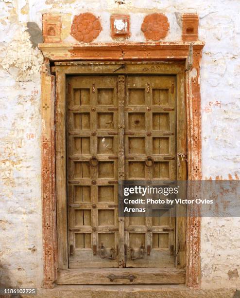 traditional rajasthani painted door in the old town of jaisalmer, rajasthan, india - jaisalmer stock pictures, royalty-free photos & images