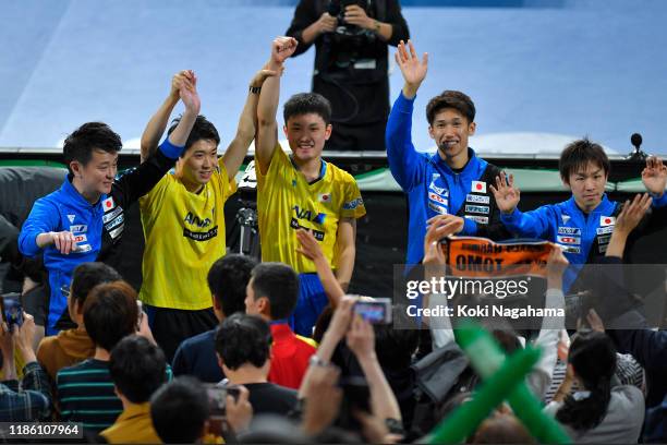 Tomokazu Harimoto, Maharu Yoshimura and Koki Niwa of Japan acknowledge fans after winning Men's Teams - Quarterfinals on day two of the ITTF Team...