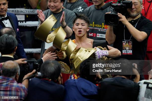 Naoya Inoue of Japan celebrates with the trophy after defeating Nonito Donaire of the Philippines at the WBSS Bantamweight Final at Saitama Super...